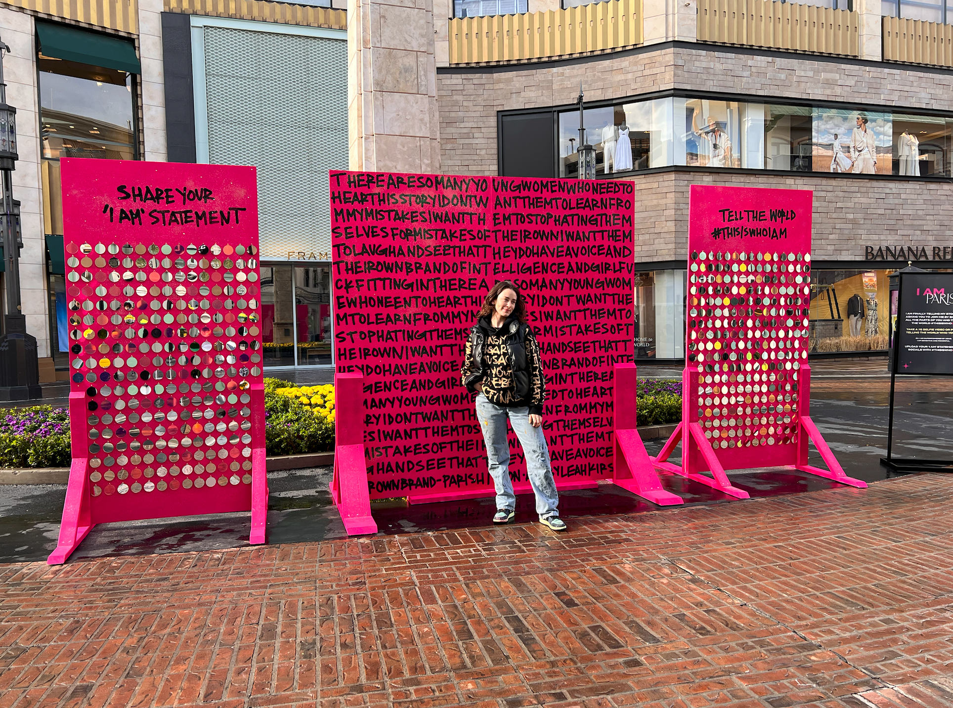 Graffiti Artist Leah Kirsch standing in front of art installation for Paris Hilton at The Grove