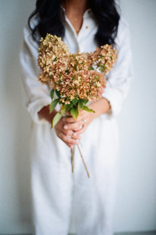 woman holding flowers