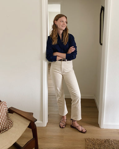 woman leaning against wall