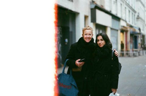 two women in black coats