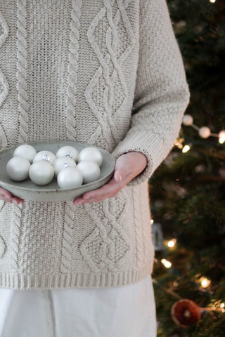 woman holding ornaments