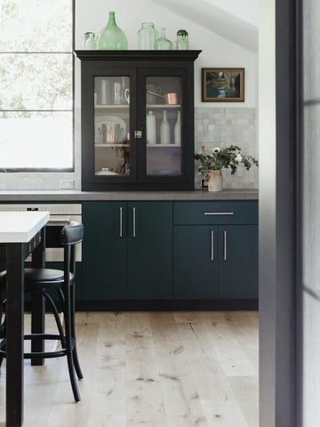 green galley kitchen with vintage vitrine
