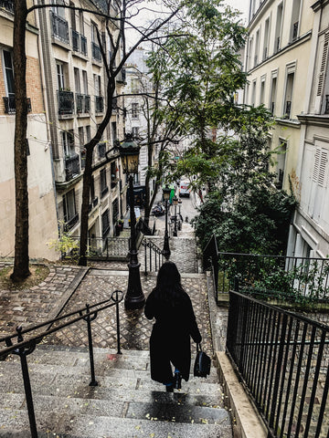 woman walking down stairs paris