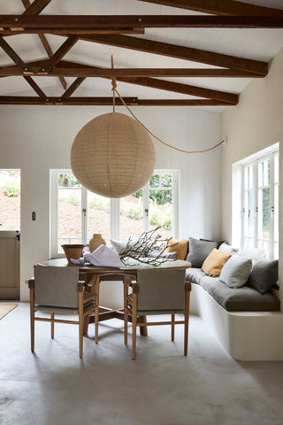 natalie walton interiors couch sofa linen pillows large round rice paper lantern pendant light