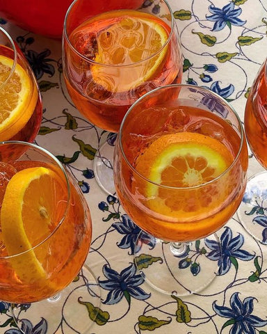 aperol spritz on floral tablecloth