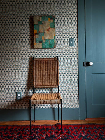 wicker chair with blue background