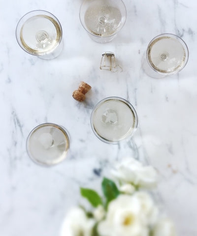 champagne coupes with florals