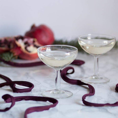 classic champagne coupe with pomegranate