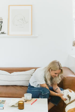 woman petting dog