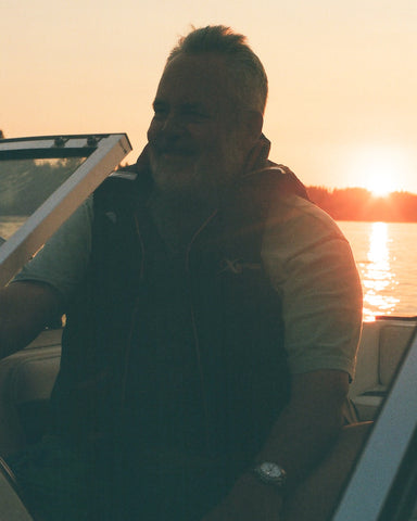 man smiling on boat
