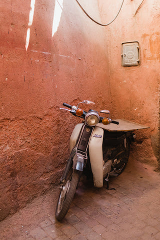 motorcycle on pink wall in marrakech
