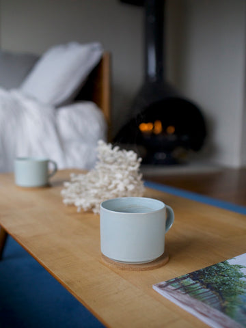 stinson beach mid century modern air bnb vacation rental blue coffee cups fireplace coral decor