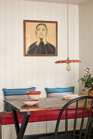 dining table with abstract painting of woman