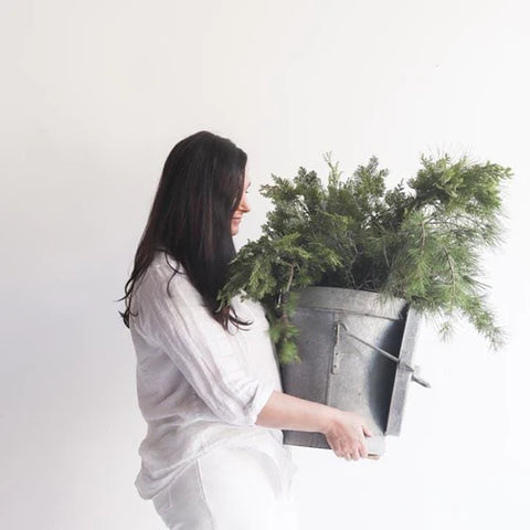 woman with bucket of greens