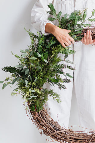 woman holding wreath