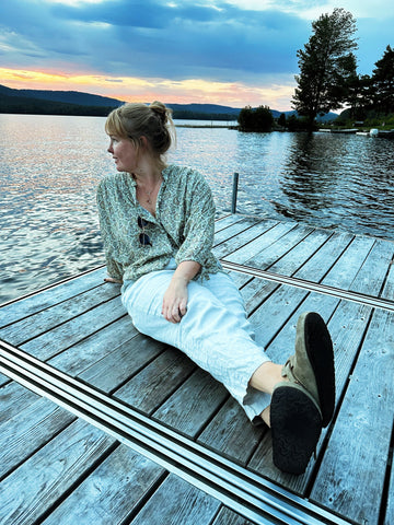 woman on dock by the lake