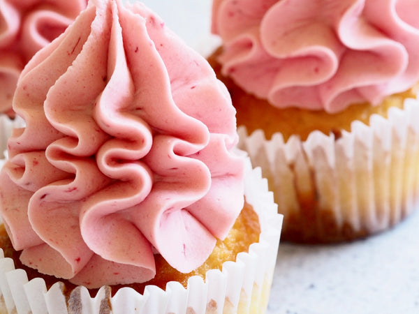 Pink frosting on cupcakes