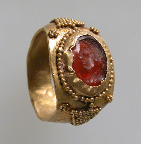 A gold Frankish ring featuring a carnelian/sard intaglio