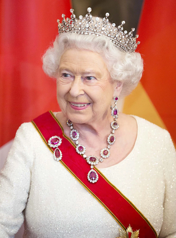 Queen Elizabeth II wearing the Crown Ruby Necklace with accompanying earring and brooch