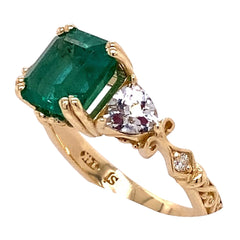 2.8ct GIA Certified Emerald Ring set with White Sapphires set in a 14kt Yellow Gold