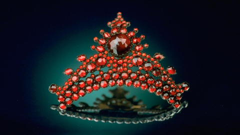 An antique hairpin featuring rose-cut pyrope garnet gemstones