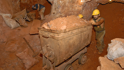 Miners working underground at the Anahi Mine. Image: Robert Weldon/ GIA