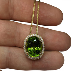 GIA Certified Peridot Pendant set with Diamonds in 14kt White Gold