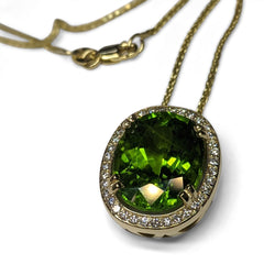 GIA Certified Peridot Pendant set with Diamonds in 14kt Yellow Gold