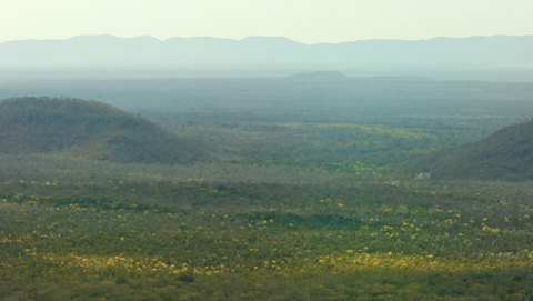 The area of the Anahi Mine; although not easily visible, the mine entrance is in frame between the two small mountains pictured. Image: Robert Weldon/ GIA