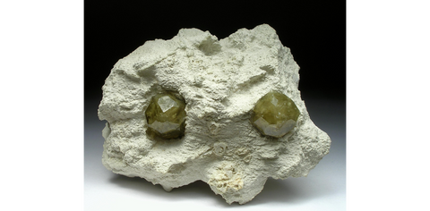 Yellow-green “gooseberry” grossular garnet crystals on matrix from the Sakha Republic of Siberia, Russia. Image: Mindat/ Gerard van der Veldt