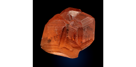 An orange hessonite garnet cluster from the Jeffrey Mine, Quebec, Canada. Image: Mindat/ Weinrich Minerals