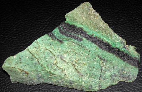 Rough green hydrogrossular garnet with black chromitite from South Africa. Image: Wikimedia Commons