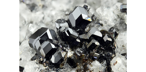 Melanite garnet crystals on matrix from Lazio, Italy. Image: Mindat/ Chinellato Matteo