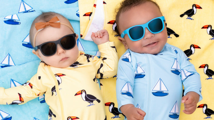 Babies wearing swimwear and sunglasses