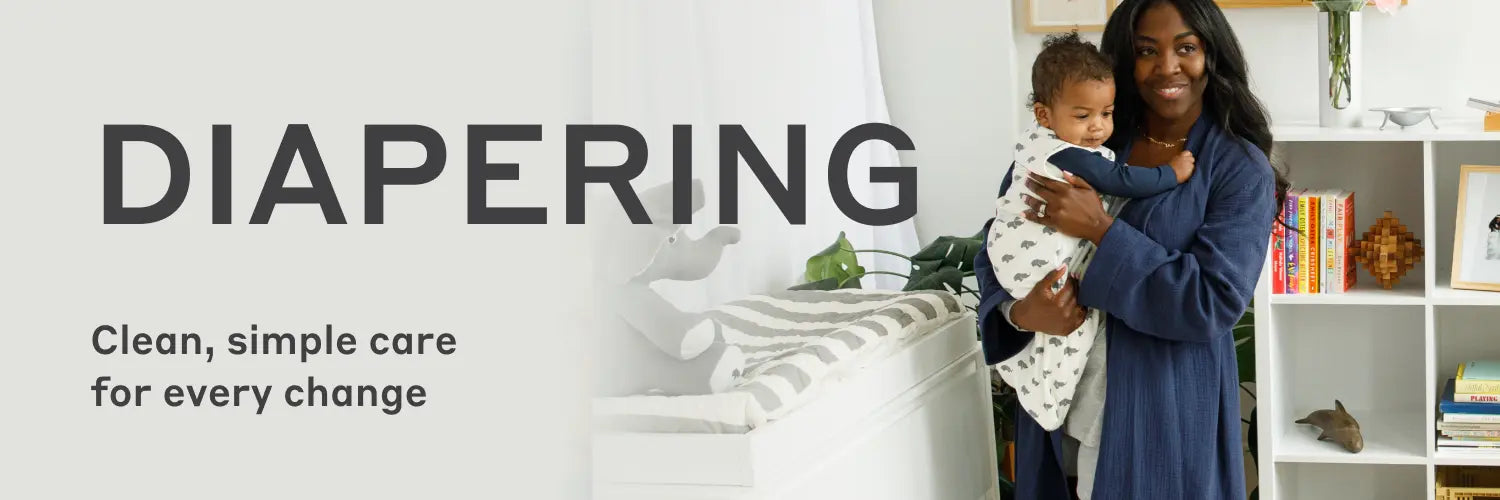 Banner with text 'DIAPERING' and 'Clean, simple care for every change', showing a smiling woman holding a baby in a nursery setting.