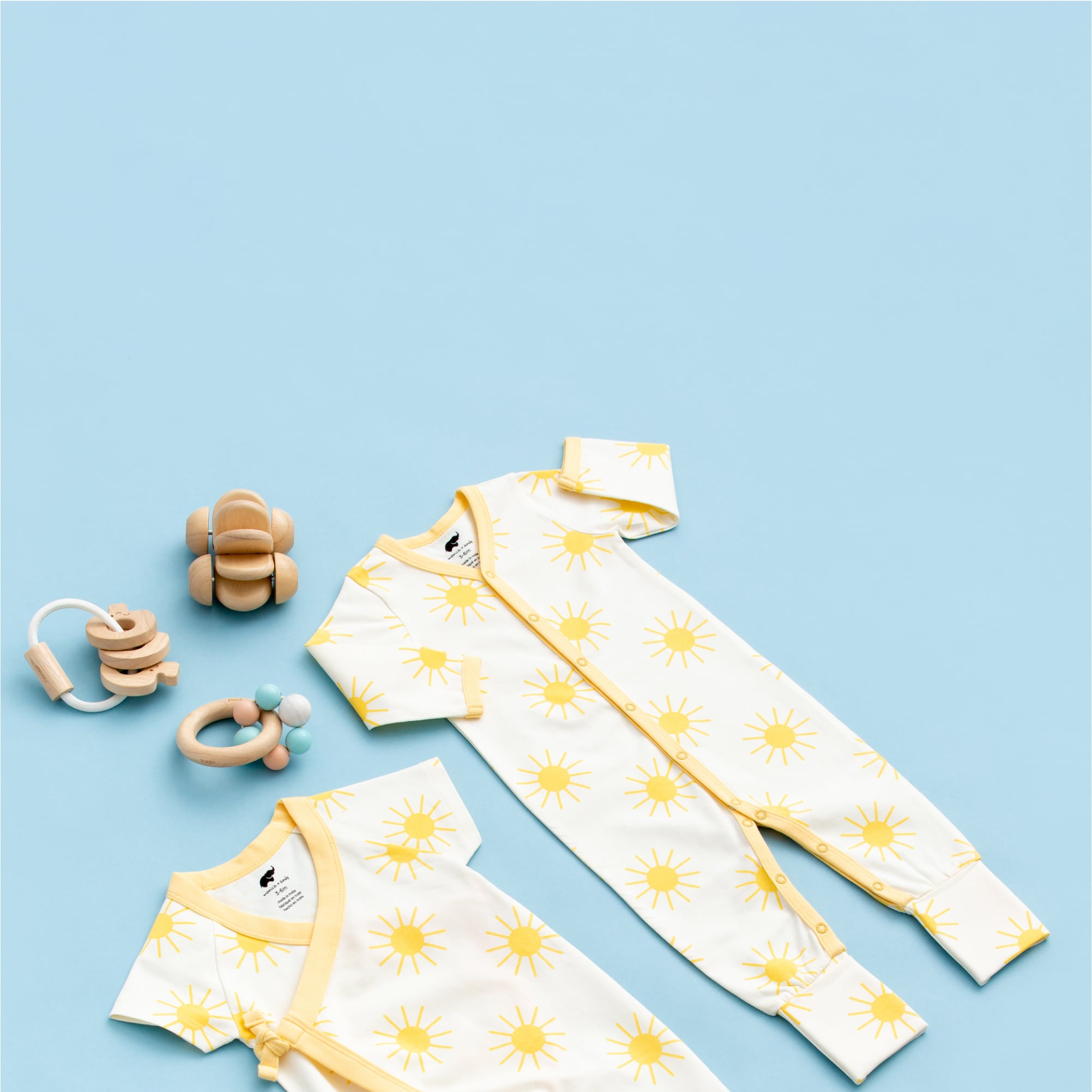 Flatlay of Suns Out print clothing on yellow background