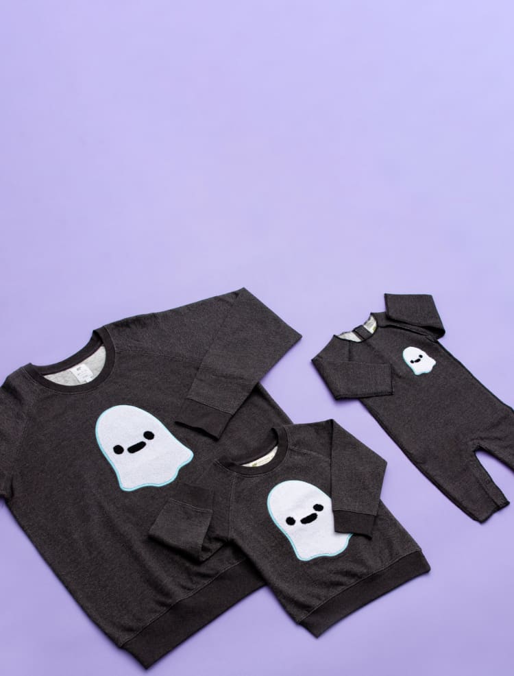 Flatlay of Friendly Ghosts print clothing on purple background