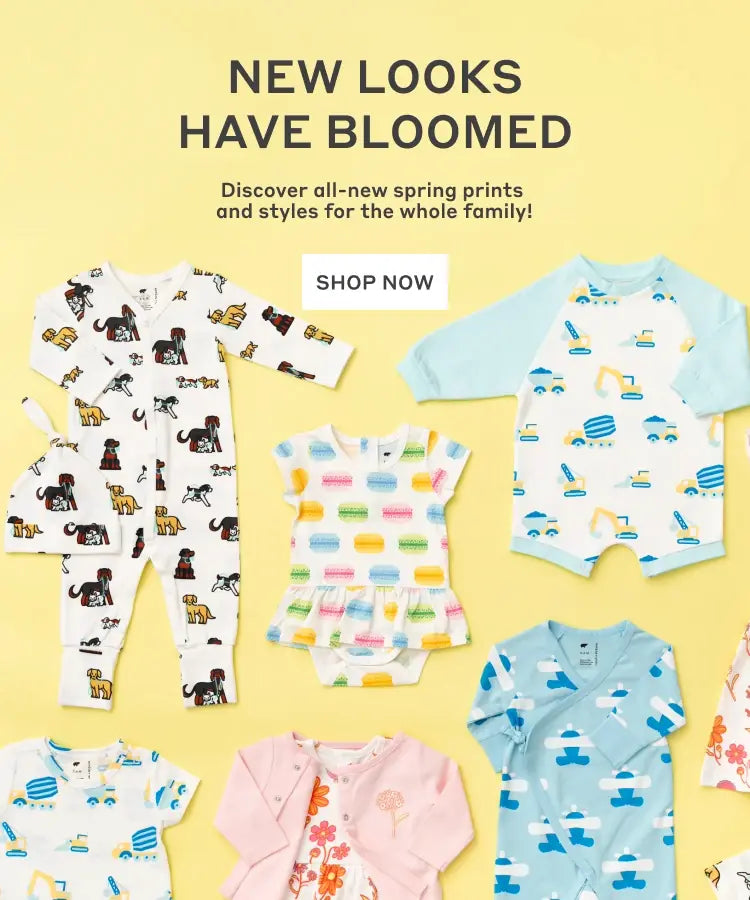 Hero banner with flatlay of spring print clothing with text: New Looks Have Bloomed. Discover all-new spring prints and styles for the whole family! - Shop Now