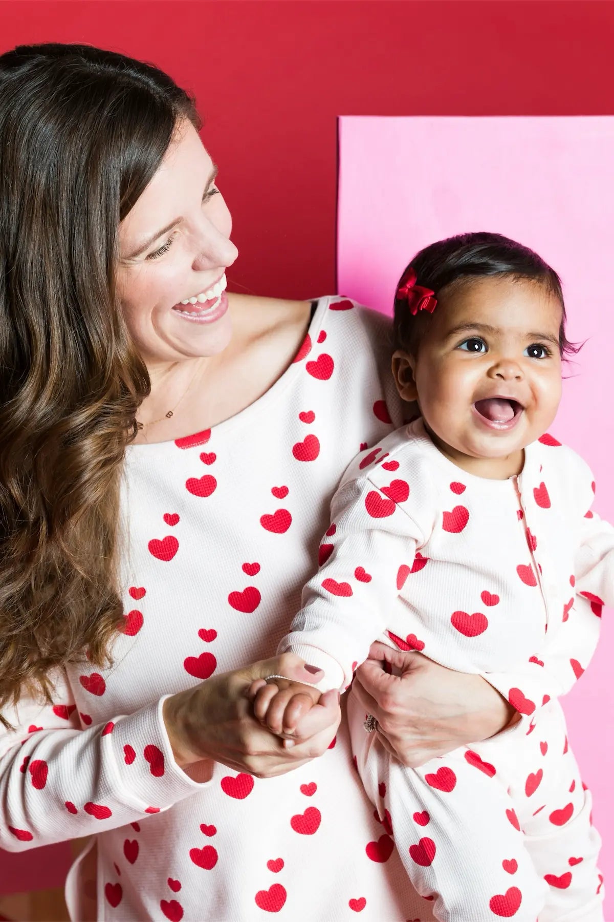 Mother and baby in matching Red Hearts print clothing