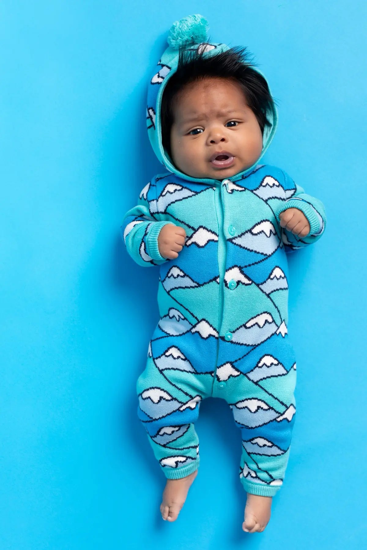 Very cute baby in Mountain Tops hooded romper