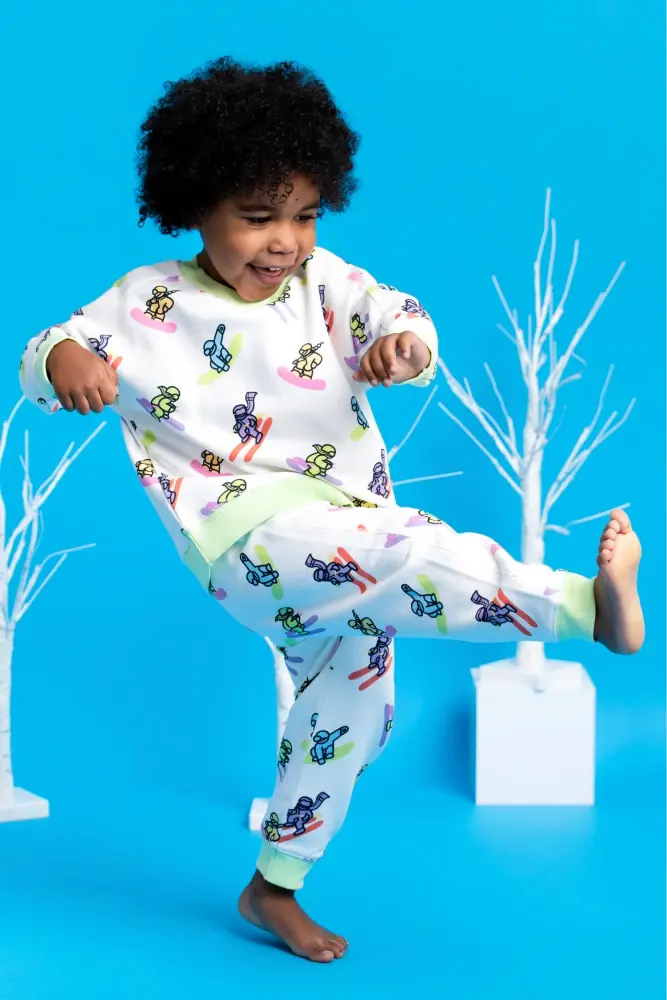 Toddler in Ski Squad print clothing