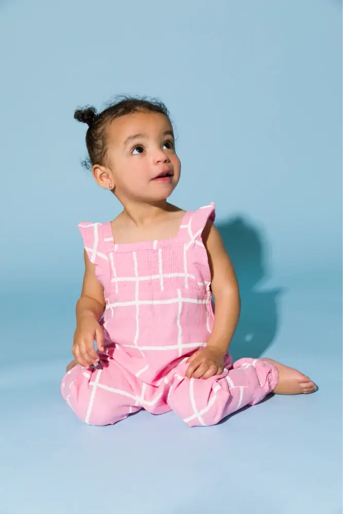 Toddler girl in Sleeveless Gauze Ruffle Romper in Pink Gingham