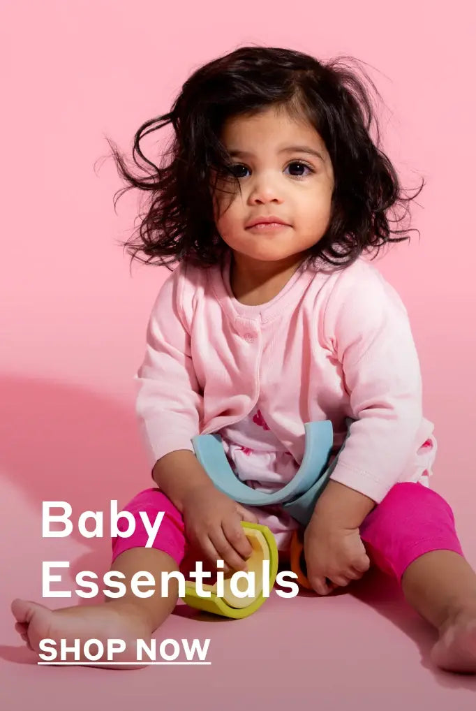 Baby girl in solid color baby clothes