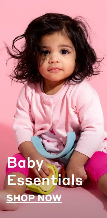 Baby girl in solid color baby clothes