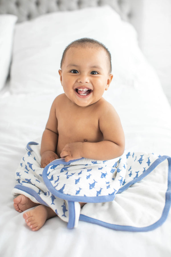 Baby with Always Blanket on bed