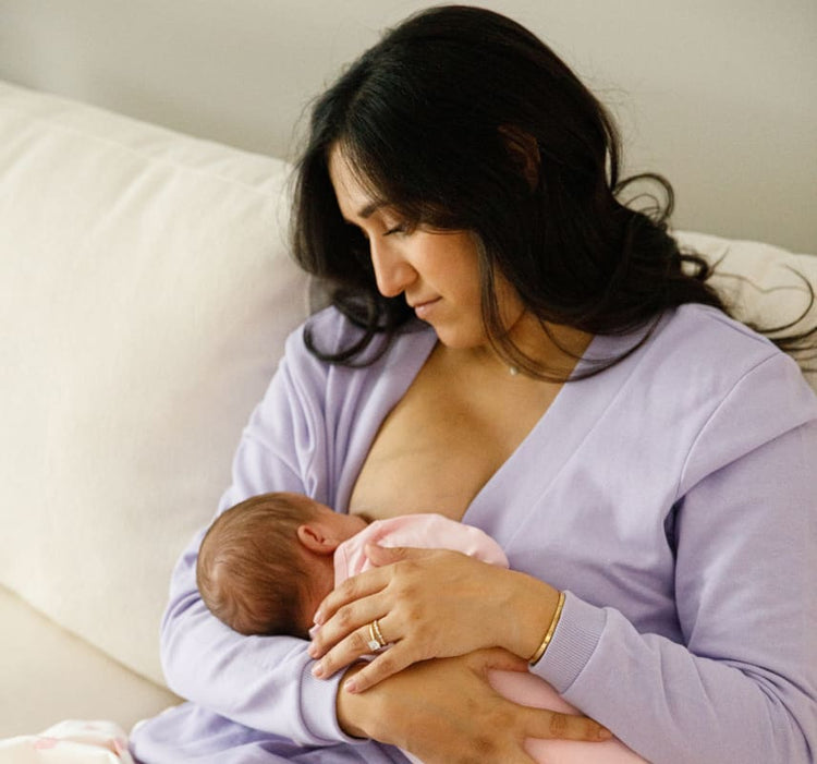 Mother holding newborn to her chest