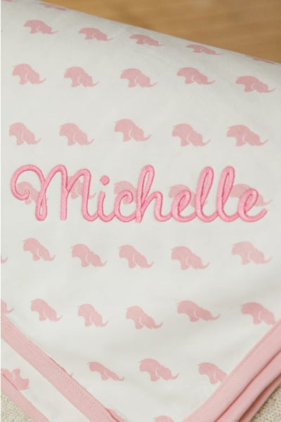 Close up of blanket with embroidered name 'Michelle'
