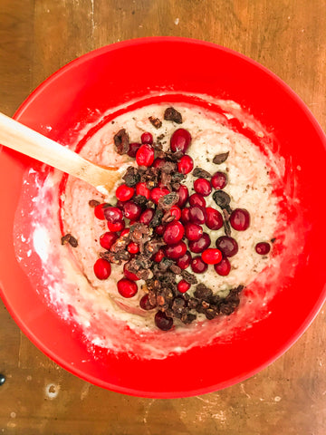 raw cranberry and cranberry and walnut sustainable snacks in red bowl