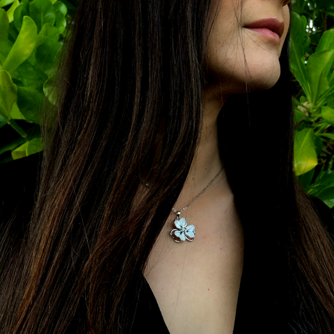 <img src="white flower necklace.png" alt="flower pendant in white and a crystal in the middle">