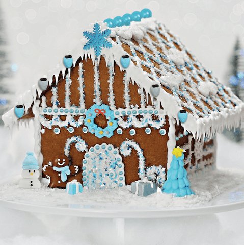 Blue and silver glittery gingerbread house made with Bakery Bling's Winter Wonderland Designer Gingerbread House Kit purchased at Hobby Lobby